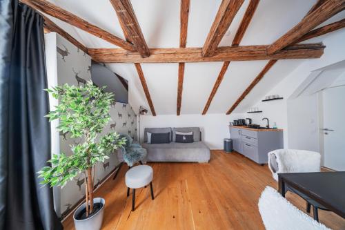 a living room with a bed and a table at Innsbruck City Chalet in Innsbruck