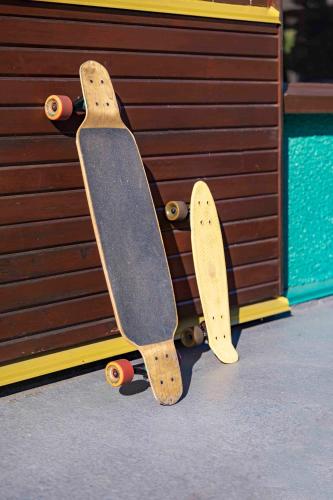 two skateboards are leaning against a wall at Hotel Zed Victoria in Victoria
