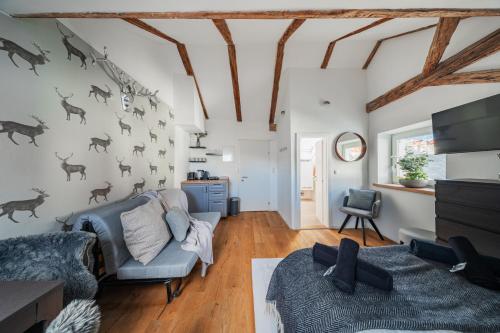 a living room with a couch and a chair at Innsbruck City Chalet in Innsbruck