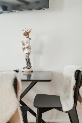 a statue of a reindeer sitting on a table at Innsbruck City Chalet in Innsbruck