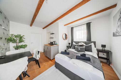 a bedroom with a bed and a desk in it at Innsbruck City Chalet in Innsbruck
