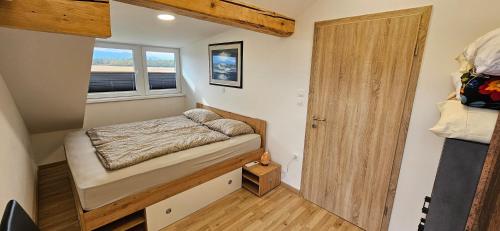 Postel nebo postele na pokoji v ubytování Apartma AJJA