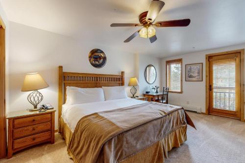a bedroom with a bed and a ceiling fan at Lion Square Lodge East 310 in Vail