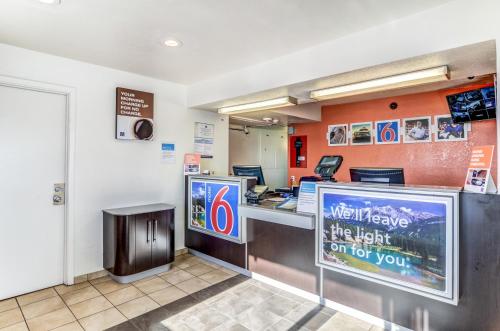 a kitchen with a television and a refrigerator at Motel 6-Fort Collins, CO in Fort Collins