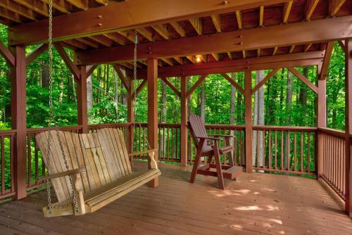 two chairs on a porch with a gazebo at 1 Sublime View in Boone