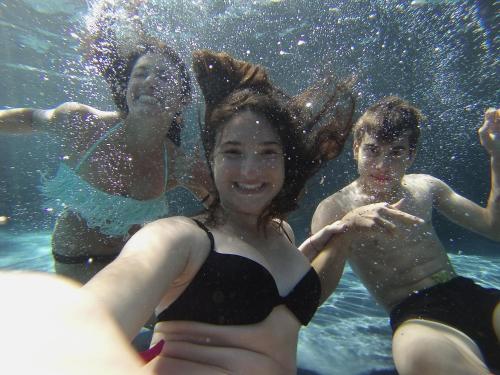 a group of people swimming in the water at Tuttaterra in Serra San Quirico