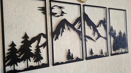 a wall with a shadow of a bird on a mountain at Cosy'PY in Bagnères-de-Bigorre