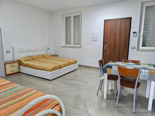 Ένα ή περισσότερα κρεβάτια σε δωμάτιο στο Ruffini House