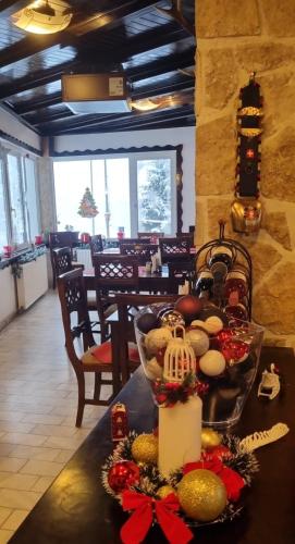 a table with a bowl of food on top of it at Pensiunea Alpin Predeal in Predeal
