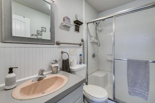 a bathroom with a sink and a toilet and a shower at Family-Friendly Riverhouse Fishing and Hot Tub in Elizabethton