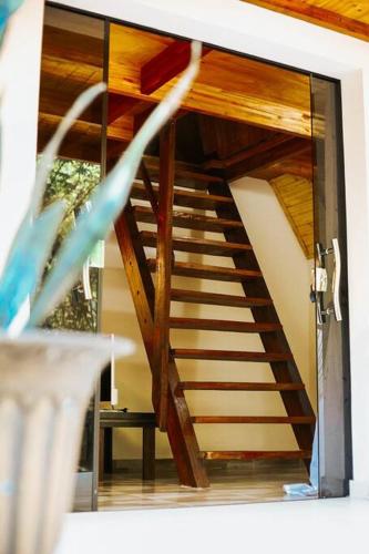 a staircase in a house with a glass door at Cabaña El Bosque in Independencia