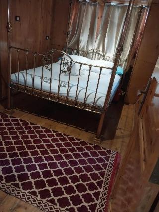 a bedroom with a bed with a canopy at Nubian Sandal in Aswan