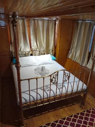 a bed in a room with a canopy at Nubian Sandal in Aswan