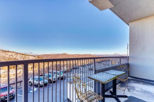 a balcony with a table and a parking lot at Sugar Top 2105 in Sugar Mountain
