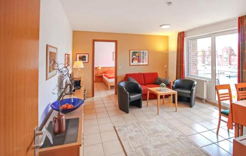 a living room with a couch and a table at Ferienwohnung Ueckermünde in Ueckermünde