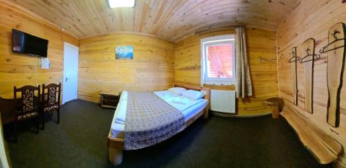 Postel nebo postele na pokoji v ubytování Alpin Eco Chalet & Wellness
