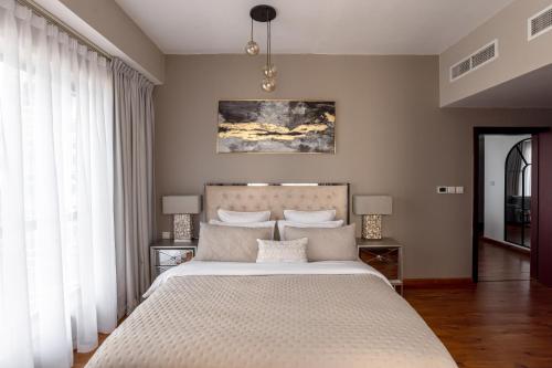 Ένα ή περισσότερα κρεβάτια σε δωμάτιο στο Beautiful 1 bedroom by the JBR beach! Bahar