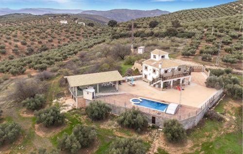 an aerial view of a house with a swimming pool at Pet Friendly Home In Algarinejo in Algarinejo