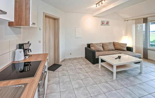 a living room with a couch and a table at Ferienwohnung Kemnitz in Neuendorf