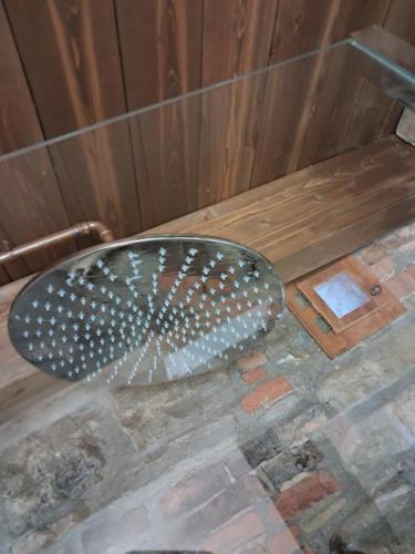 a metal seat in a bath tub in a room at The Mandarine, Orangery Retreat in Tursi