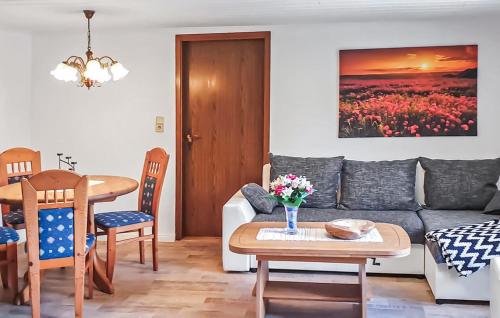 a living room with a couch and a table at Ferienhaus Reetzowusedom in Reetzow