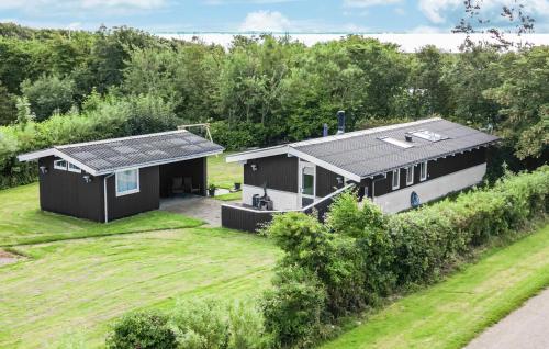 an overhead view of a black house with a yard at 3 Bedroom Beautiful Home In Vinderup in Vinderup