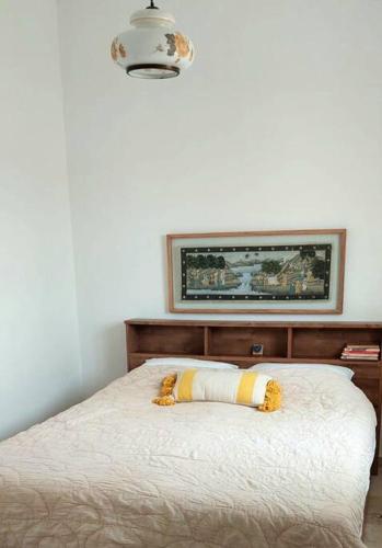 a stuffed animal laying on a bed in a bedroom at בקתה וטבילה במדבר in H̱aẕeva