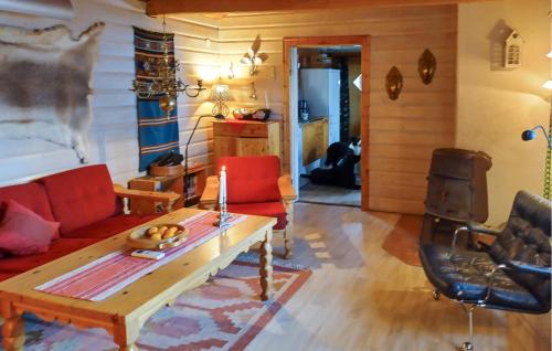 a living room with a couch and a table at Gorgeous Home In Särna With Sauna in Ringbo