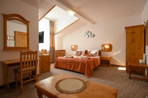 a bedroom with a bed with two dogs on it at Vezyuva House in Bansko