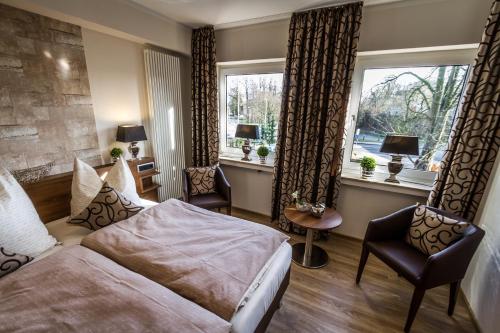מיטה או מיטות בחדר ב-Hotel Restaurant Hackmann-Atter