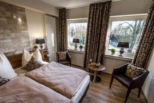 Postel nebo postele na pokoji v ubytování Hotel Restaurant Hackmann-Atter