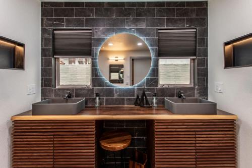 a bathroom with two sinks and a mirror at Luxury on Ocean Drive - Sleeps 28 in Corpus Christi