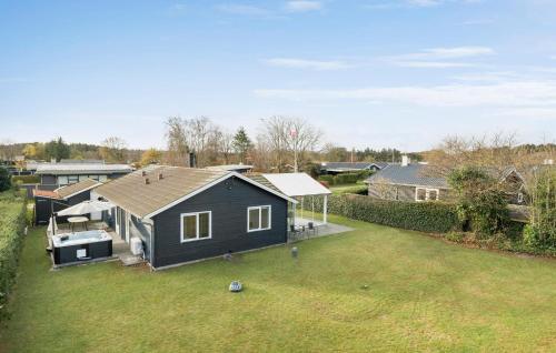 an aerial view of a house with a yard at 4 Bedroom Stunning Home In Hadsund in Hadsund