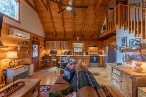 a living room with a couch and a kitchen at Moonlight Lodge in Fleetwood