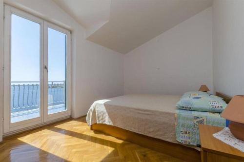 Posteľ alebo postele v izbe v ubytovaní Apartments Mil