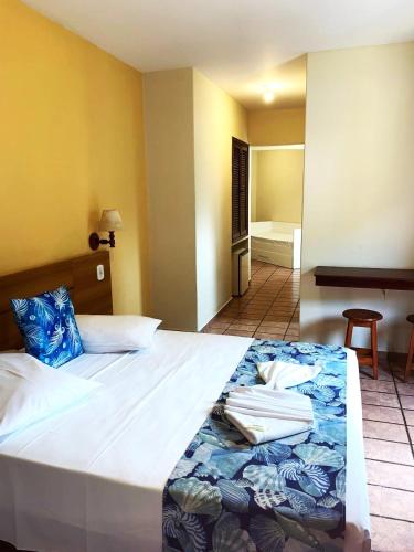 Katil atau katil-katil dalam bilik di Hotel Ponta das Toninhas