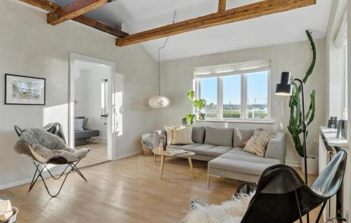 a living room with a couch and chairs at 3 Bedroom Cozy Home In Nibe in Nibe
