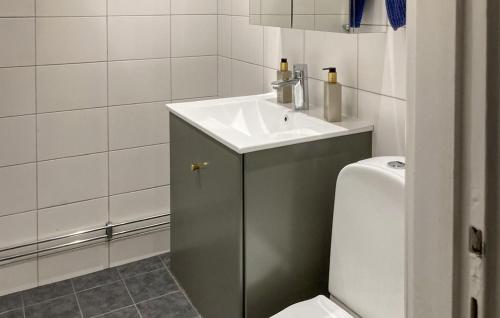 a bathroom with a sink and a toilet at Nice Home In Trosa With Wifi in Trosa