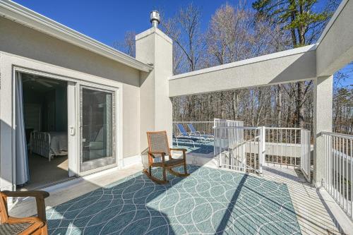 a balcony of a house with a patio at Straight to the Point in Bumpass