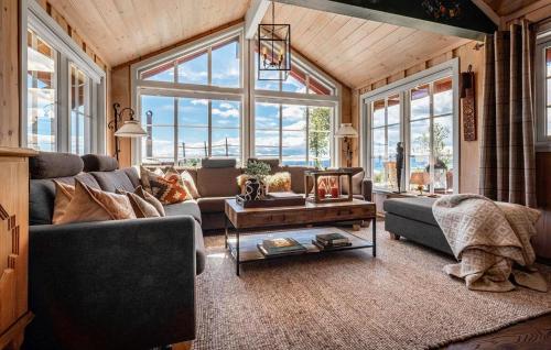 a living room with a couch and a table at 4 Bedroom Stunning Home In Hemsedal in Hemsedal