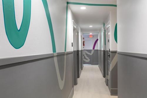 a hallway of a hospital with a v sign on the wall at La Ventana in San Diego