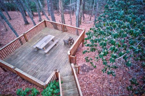 an overhead view of a wooden deck with a bench at Fox's Lair in Sugar Grove