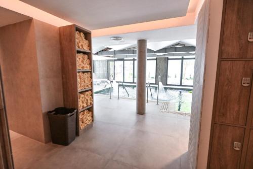 a room with a wall of fire wood at Hotel Denver Mar del Plata in Mar del Plata