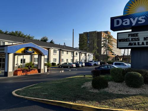 a sign in front of aadobeadobeadobeadobeadobeadobeadobeadobeadobeadobe at Days Inn by Wyndham Runnemede Philadelphia Area in Runnemede