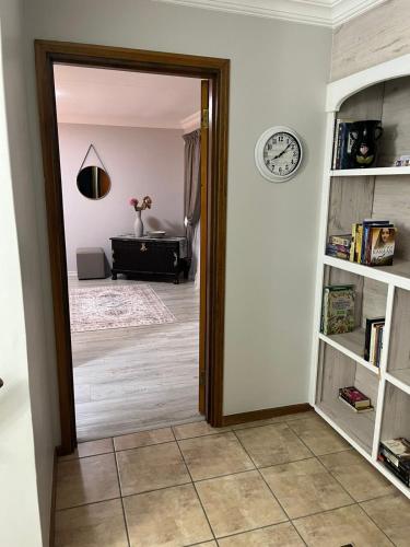 a hallway with a door leading to a living room at Rose Manor, Hartenbos Heuwels in Mossel Bay