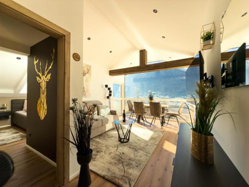 a living room with a view of the ocean at Posthof - Alpine Living Apartments in Campo di Trens