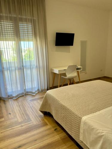 Ένα ή περισσότερα κρεβάτια σε δωμάτιο στο Guest House Levante