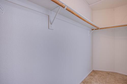 an empty room with white walls and a wooden pole at Red Rock Vacation Villa in Las Vegas