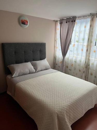 Postel nebo postele na pokoji v ubytování Apartamento Entero Sector Exclusivo De Zipaquira