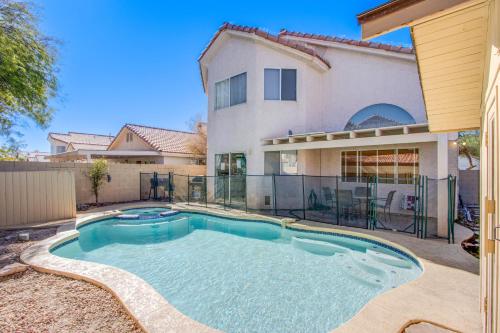 a swimming pool in front of a house at Red Rock Vacation Villa in Las Vegas